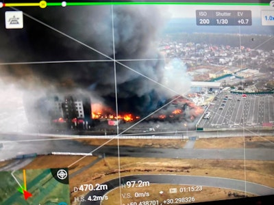 Aerial image taken by a drone shows a blown-up building near the outskirts of Kyiv.