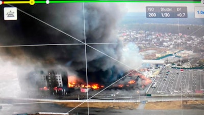 Aerial image taken by a drone shows a blown-up building near the outskirts of Kyiv.