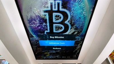 Bitcoin logo on the display screen of a cryptocurrency ATM at the Smoker's Choice store in Salem, N.H., Feb. 9, 2021.