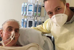 David Bennett Jr., right, stands next to his father's hospital bed in Baltimore, Md., Jan. 12, 2022.
