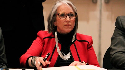 New Mexico Gov. Michelle Lujan Grisham prepares to sign an executive order, Albuquerque, March 10, 2022.