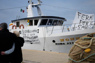 A fishing boat with banners protesting gasoline price increases, Fiumicino, Italy, March 11, 2022.