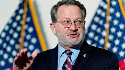 Sen. Gary Peters, D-Mich., at a news conference on Capitol Hill, Feb. 8, 2022.