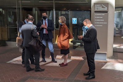 Former Theranos executive Ramesh 'Sunny' Balwani, right, stands near his legal team outside Robert F. Peckham U.S. Courthouse in San Jose, Calif., March 1, 2022.