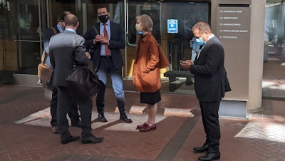 Former Theranos executive Ramesh 'Sunny' Balwani, right, stands near his legal team outside Robert F. Peckham U.S. Courthouse in San Jose, Calif., March 1, 2022.