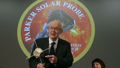 Eugene Parker holds a replica of the Parker Solar Probe at the William Eckhardt Research Center at the University of Chicago, May 31, 2017.