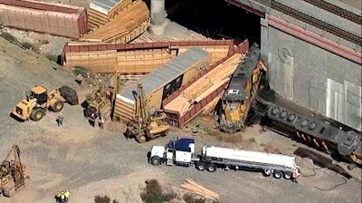 Image from video of emergency personnel at the site of a derailed Union Pacific freight train, Colton, Calif., March 21, 2022.