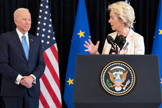 President Joe Biden listens as European Commission President Ursula von der Leyen speaks about the Russian invasion of Ukraine at the U.S. Mission in Brussels, March 25, 2022.