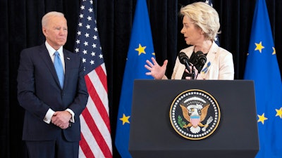 President Joe Biden listens as European Commission President Ursula von der Leyen speaks about the Russian invasion of Ukraine at the U.S. Mission in Brussels, March 25, 2022.