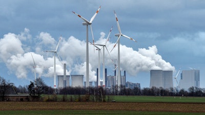 Wind generators in front of a coal-fired power plant near Jackerath, Germany, Dec. 7, 2018.
