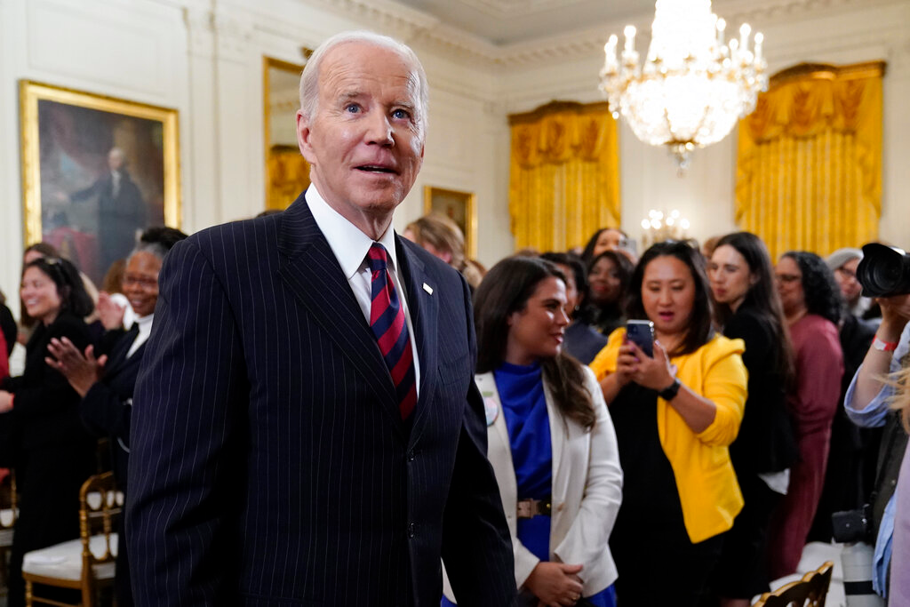 President Joe Biden departs after speaking an event to celebrate Equal Pay Day and Women's History Month in the East Room of the White House, Tuesday, March 15, 2022, in Washington.