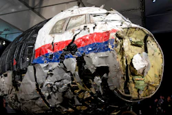 This Tuesday, Oct. 13, 2015 file photo, shows the reconstructed wreckage of Malaysia Airlines Flight MH17, put on display during a press conference in Gilze-Rijen, central Netherlands. The Dutch and Australian governments on Monday, March 14, 2022, have launched a legal case against Russia at the International Civil Aviation Organization seeking to hold Moscow accountable for its alleged role in the downing of Malaysia Airlines flight MH17.