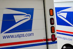 In this Aug. 18, 2020, photo, mail delivery vehicles are parked outside a post office in Boys Town, Neb. Democrats on the House Oversight Committee are seeking an investigation into a U.S. Postal Service plan to replace its aging mail trucks with mostly gasoline-powered vehicles.