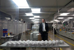Jim Schmersahl, owner of Halcyon Shades, poses in a 'clean room' used in making N-95 masks at the company's production facility Friday, March 18, 2022, in University City, Mo. Halcyon is small company that normally makes window shades, but when the pandemic hit, its sales plummeted. Halcyon applied for the state grants to make PPE as a way to try to keep its employees at work and keep the company afloat.