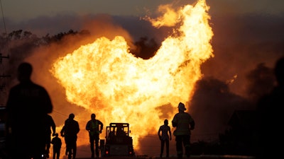 A fire roars through a neighborhood in San Bruno, Calif., Sept. 9, 2010.