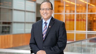 Rashid Bashir, the dean of the Grainger College of Engineering, co-led a team that developed a portable, point-of-care testing device capable of differentiating between the COVID-19 alpha variant and earlier strains of the virus in saliva samples.
