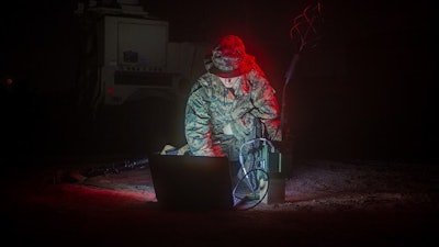 A U.S. military transmissions system operator establishes communications using a multi-band-networking-manpack. The Protected Tactical Enterprise Service (PTES) will provide ground-based Protected Tactical Waveform (PTW) processing, enabling secure operations and protected tactical communications coverage over Wideband Global SATCOM (WGS) satellites.
