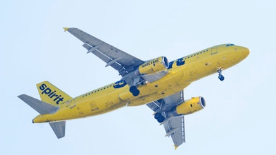 A Spirit Airline aircraft flying over Gloster City, N.J., approaches Philadelphia International Airport Friday, Oct. 22, 2021. JetBlue Airways has offered to buy Spirit Airlines for about $3.6 billion and break up a plan for Spirit to merge with rival budget carrier Frontier Airlines. Spirit said Tuesday, April 5, 2022, that its board will evaluate the JetBlue bid and decide what's best for its shareholders.