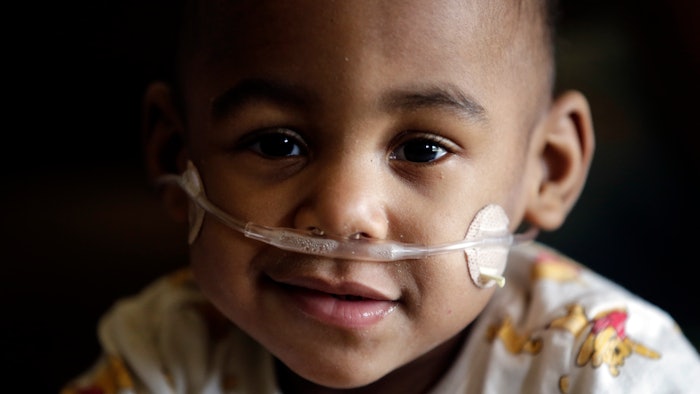 Curtis Means plays in his walker at home in Eutaw, Ala., on Wednesday, March 23, 2022. Growing numbers of extremely premature infants, like Curtis, are getting life-saving treatment and surviving.