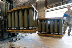 U.S. Air Force Staff Sgt. Cody Brown, right, with the 436th Aerial Port Squadron, checks pallets of 155 mm shells ultimately bound for Ukraine, Friday, April 29, 2022, at Dover Air Force Base, Del. President Joe Biden asked Congress on Thursday for $33 billion to bolster Ukraine's fight against Russia, signaling a burgeoning and long-haul American commitment.