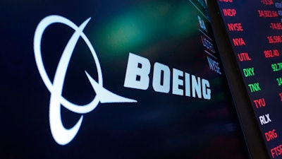 In this July 13, 2021, photo, the logo for Boeing appears on a screen above a trading post on the floor of the New York Stock Exchange. Boeing Co., a leading defense contractor and one of the world's two dominant manufacturers of airline planes, is expected to move its headquarters from Chicago to the Washington, D.C., area, according to two people familiar with the matter. The decision could be announced as soon as later Thursday, May 5, 2022, according to one of the people.
