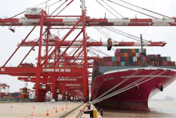 In this photo released by Xinhua News Agency, a container ship from Japan is anchored at the container dock of Shanghai's Yangshan Port in east China on April 27, 2022. China's export growth tumbled in April after Shanghai and other industrial cities were shut down to fight virus outbreaks.