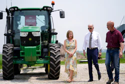 President Joe Biden walks with O'Connor Farms owners Jeff and Gina O'Connor, Kankakee, Ill., May 11, 2022.