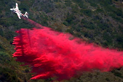 A plane drops fire retardant onto the Coastal Fire Thursday, May 12, 2022, in Laguna Niguel, Calif.