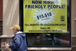 Starting wages advertised in the window of a Taco Bell in Sacramento, Calif., May 9, 2022.