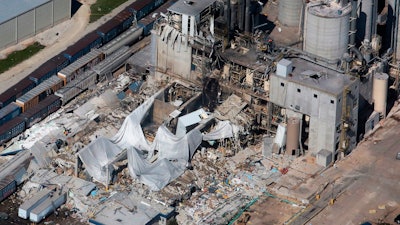 Part of the Didion Milling Plant in Cambria, Wis., lies in ruins following an explosion in this June 1, 2017 photo,. A federal grand jury has charged a milling company with fraud and conspiracy in connection with the explosion that killed five workers in 2017. Court records indicate the grand jury indictment was announced Thursday, May 12, 2022, against Didion Milling Inc. and company leaders.