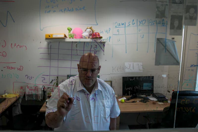 Harel Hershtik works at his lab in Rehovot, Israel, Wednesday, May 11, 2022. When he was 20 years old, Hershtik planned and executed a murder. Today, he is the brains behind an Israeli health-tech startup, poised to make millions of dollars with the backing of prominent public figures and deep-pocketed investors.