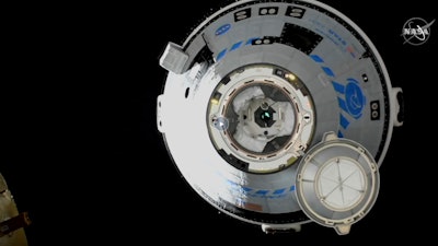 This image from NASA TV shows the Boeing Starliner approaching the International Space Station, Friday, May 20, 2022. Boeing's astronaut capsule has arrived at the International Space Station in a critical repeat test flight. Only a test dummy was aboard the capsule for Friday's docking, a huge achievement for Boeing after years of false starts.
