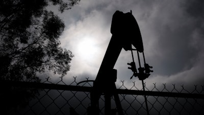 A pumpjack operates on Jan. 15, 2015, in Bakersfield, Calif. Residents of Bakersfield are concerned about potential explosions after a state agency found that six idle oil wells near homes were leaking methane in the past several days.