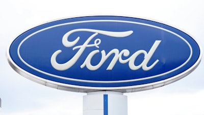 A Ford logo is seen on signage at Country Ford in Graham, N.C., Tuesday, July 27, 2021. Ford is issuing two recalls covering over 737,000 vehicles, Friday, April 1, 2022, to fix oil leaks and trailer braking systems that won't work. Ford says in government documents posted Thursday, May 19, 2022, is asking the owners of 350,000 vehicles in to take them to dealers for repairs in three recalls, including about 39,000 that should be parked outdoors because the engines can catch fire.