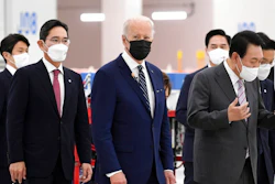 US President Joe Biden, cente, South Kroean President Yoon Suk-youl, right and Samsung Electronics Co. Vice Chairman Lee Jae-yong, second left, walk at the Samsung Electronic Pyeongtaek Campus, in Pyeongtaek, South Korea, Friday. May 20, 2022.