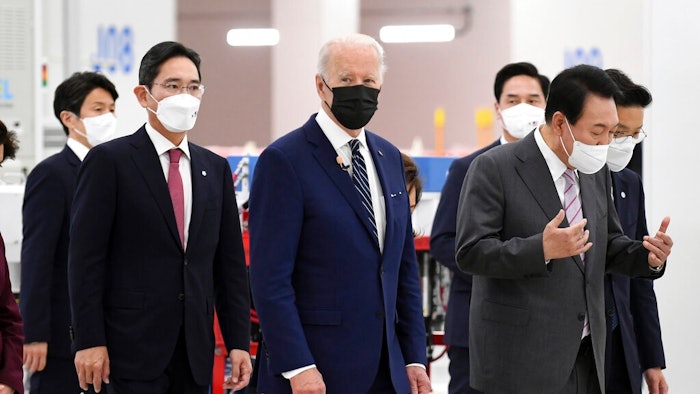 US President Joe Biden, cente, South Kroean President Yoon Suk-youl, right and Samsung Electronics Co. Vice Chairman Lee Jae-yong, second left, walk at the Samsung Electronic Pyeongtaek Campus, in Pyeongtaek, South Korea, Friday. May 20, 2022.