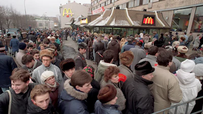 Hundreds of Muscovites line up outside the first McDonald's restaurant in the Soviet Union on its opening day, in Moscow, Jan. 31, 1990.