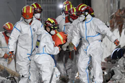 Rescuers in central China have pulled the woman alive from the rubble of a building that partially collapsed almost six days earlier, state media reported Thursday.