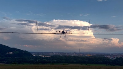 Airborne Optical Sectioning (AOS) drone prototype for real-time through-foliage tracking of moving targets.