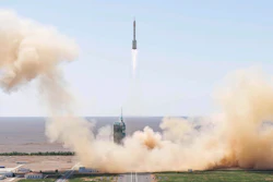 In this photo released by Xinhua News Agency, the Long March-2F carrier rocket carrying China's Shenzhou 14 spacecraft blasts off from the launch pad at the Jiuquan Satellite Launch Center in Jiuquan, northwest China's Gansu Province, Sunday, June 5, 2022. China on Sunday launched the new three-person mission to complete work on its permanent orbiting space station.