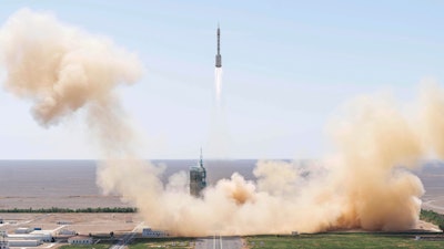 In this photo released by Xinhua News Agency, the Long March-2F carrier rocket carrying China's Shenzhou 14 spacecraft blasts off from the launch pad at the Jiuquan Satellite Launch Center in Jiuquan, northwest China's Gansu Province, Sunday, June 5, 2022. China on Sunday launched the new three-person mission to complete work on its permanent orbiting space station.