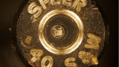 A bullet casing showing identification codes, at center, is shown through a microscope at a news conference at the Los Angeles Police Academy, Aug. 14, 2007. New York Gov. Kathy Hochul signed 10 public safety-related bills, Monday, June 7, 2022, including one that will require microstamping in new firearms, which could help law enforcement solve gun-related crimes.