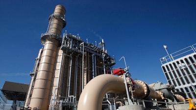 Water pipes leading to the cooling system of Pacific Gas & Electrics Colusa Generating Station near Maxwell, Calif., on Nov. 15, 2011. The utility on Wednesday, June 8, 2022, outlined a plan to achieve climate goals including net-zero emissions by 2040. The report says natural gas plants like the Colusa generating station are likely to remain online but produce 40% less emissions by 2030 compared to 2015 levels.