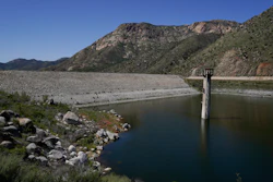 The dam at El Capitan Reservoir is seen April 8, 2022, in Lakeside, Calif. Eight years after Congress created the program, the U.S. Army Corps of Engineers is taking a first step Friday, June 10, 2022, toward offering more than $7 billion of federally backed loans to repair aging dams owned by states, local governments and private entities across the U.S.