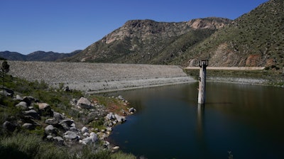 The dam at El Capitan Reservoir is seen April 8, 2022, in Lakeside, Calif. Eight years after Congress created the program, the U.S. Army Corps of Engineers is taking a first step Friday, June 10, 2022, toward offering more than $7 billion of federally backed loans to repair aging dams owned by states, local governments and private entities across the U.S.