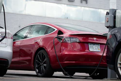 A 2021 Model 3 sedan is connected to a charger at a Tesla dealership on June 27, 2021, in Littleton, Colo. The National Highway Traffic Safety Administration said Thursday, June 9, 2022, that it's upgrading the probe into an engineering analysis, another sign of increased scrutiny of the electric vehicle maker and automated systems that perform at least some driving tasks.