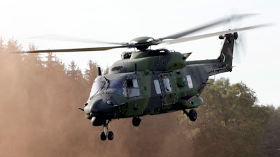 A NH90 multipurpose helicopter takes off during a demonstration event held for the media by the German Bundeswehr in Bergen near Hannover, Germany, Wednesday, Sept. 28, 2011. NATO-member Norway has terminated its contract for 14 NH90 helicopters, citing delays, errors, time-consuming maintenance, will return all choppers while demanding full refund of the nearly 5 billion ($525 million) kroner, the defense minister said Friday, June 10, 2022.