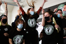 Starbucks employees and supporters react as votes are read during a viewing of their union election, Dec. 9, 2021, Buffalo, N.Y.