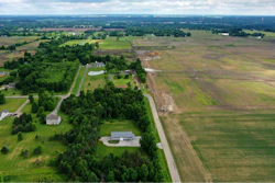 This aerial image taken with a drone on June 9, 2022 shows a portion of land in Johnstown, Ohio, where Intel plans to build two new processor factories. The houses on the left are up for demolition. The $20 billion project spans nearly 1,000 acres. Construction is expected to begin in 2022, with production coming online at the end of 2025.