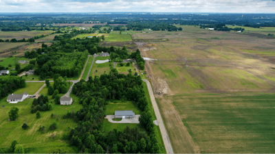 This aerial image taken with a drone on June 9, 2022 shows a portion of land in Johnstown, Ohio, where Intel plans to build two new processor factories. The houses on the left are up for demolition. The $20 billion project spans nearly 1,000 acres. Construction is expected to begin in 2022, with production coming online at the end of 2025.